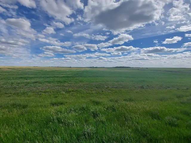 Prairie farmland under a big sky